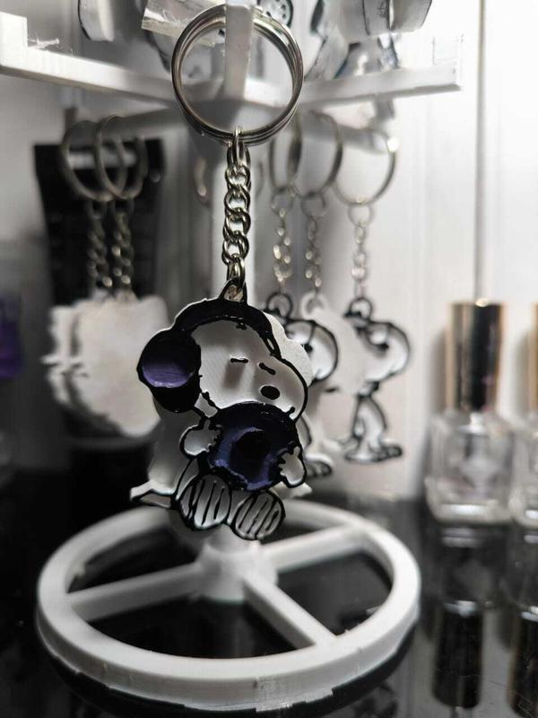 snoopy keychain listening to music