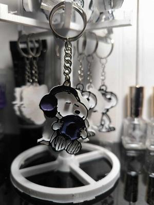 snoopy keychain listening to music