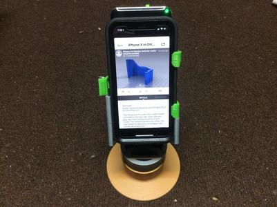 iPhone X in Otterbox Defender cradle/stand for car/desk