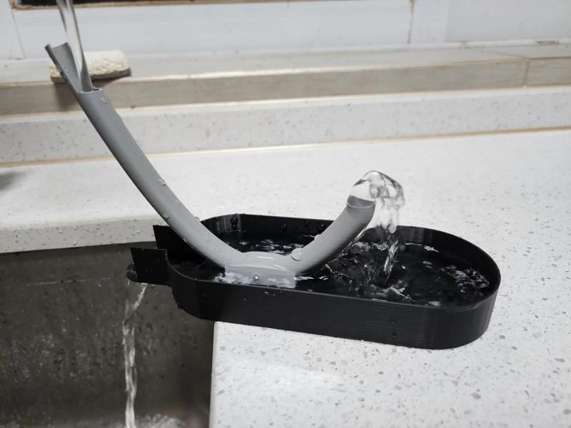 Cat drinking fountain