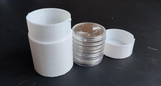 Silver storage box: Ounces in standard X10 capsules.