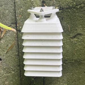 Small rectangular shelter for weather sensor.