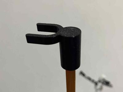 Wall fan oscillation knob hook attachment