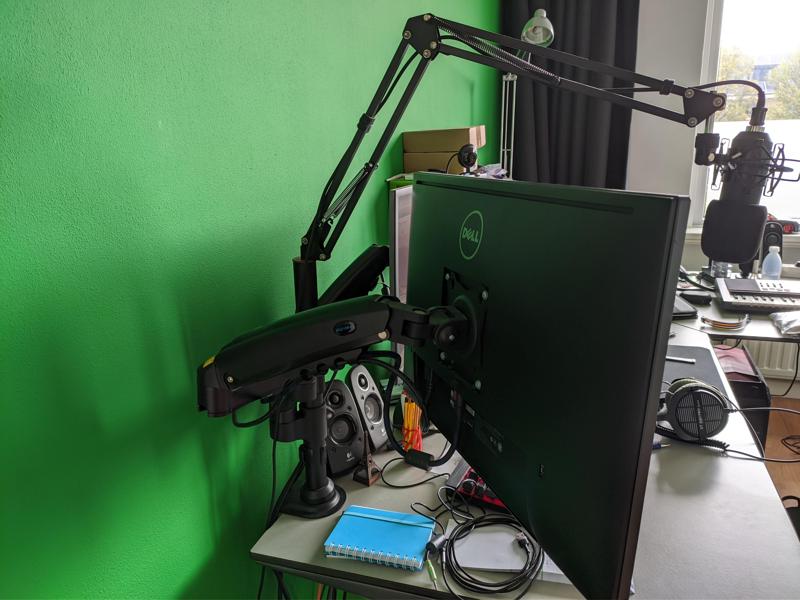 Monitor arm insert for microphone arm