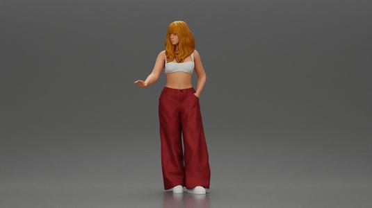Chola style woman white top red baggy pants posing.