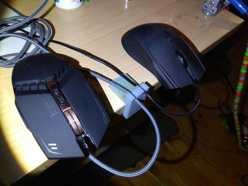 Mouse cable holder for 2 different cables 