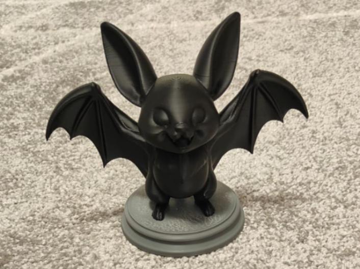 Cartoon-style bat miniature.