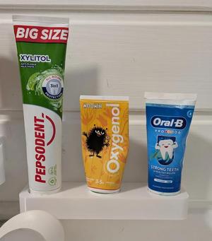 Toothpaste wall holder   