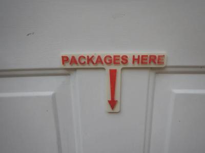 "Packages Here" Sign   