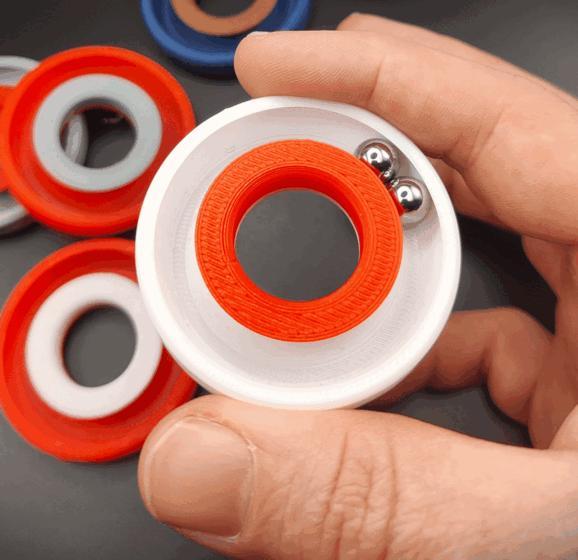 Kinetic marble ring infinite fidget toy