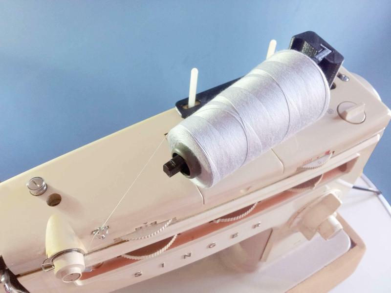 Horizontal sewing thread spool holder.