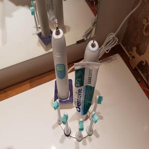 Five toothbrushes Sonicare stand
