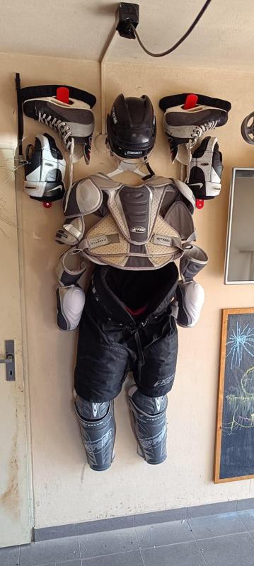 Hockey equipment wall holder