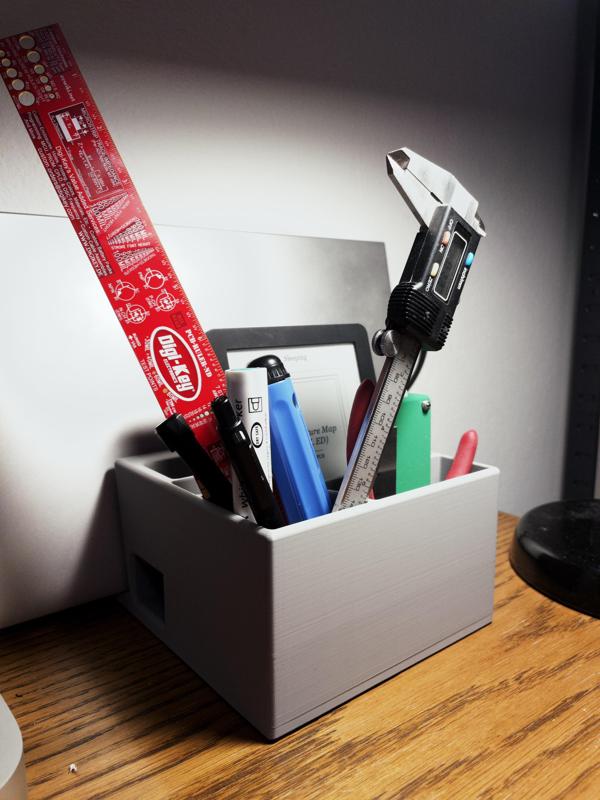Desktop organiser with notebook stand (added features)