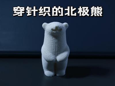 A polar bear in a knitted sweater