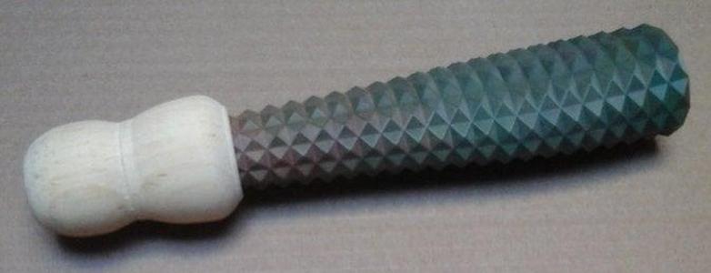 Scraper precussion instrument