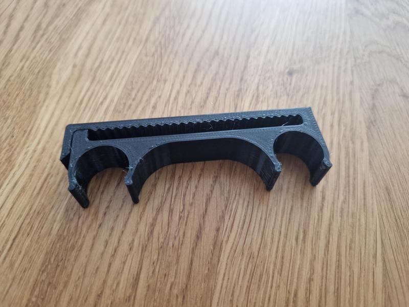 Trekking poles clip for backpack shoulder strap