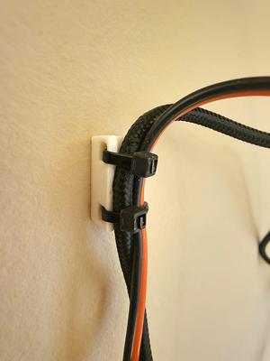 Parametric wall mounted cable strain relief clip