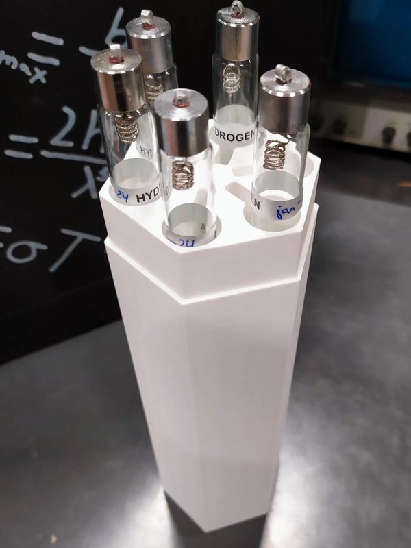 Spectral discharge tube container