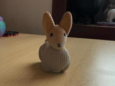 Rabbit with black eyes and nose in knitted effect