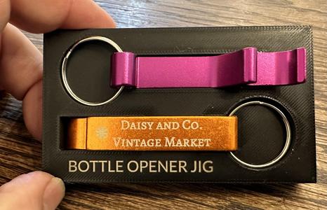 Bottle opener fixture for laser engraving