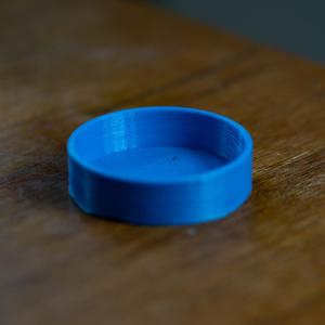 Lens cap for M. Zuiko 75 mm lens.