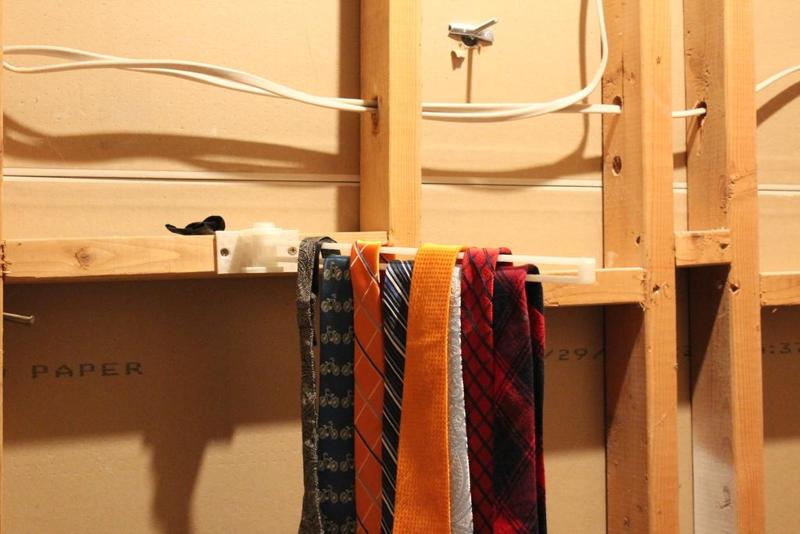 swing arm tie rack