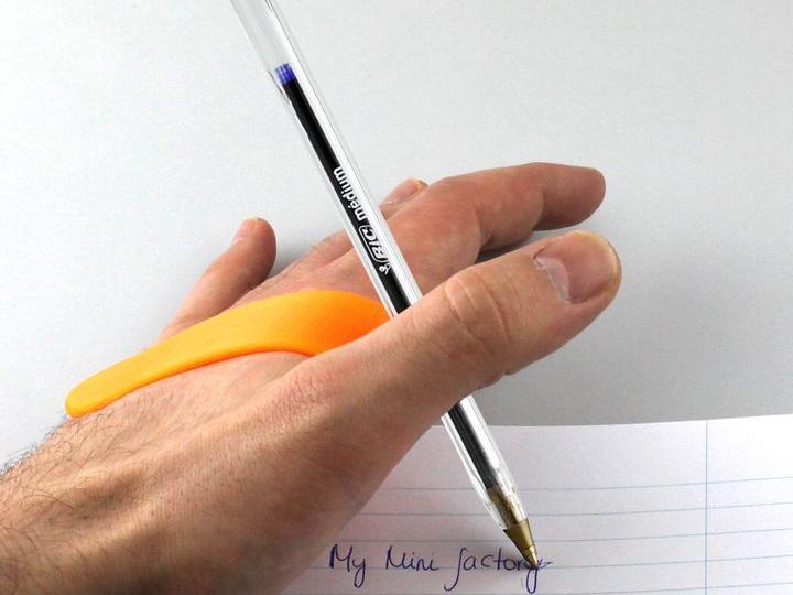 Ergonomic pen holder – disability aid