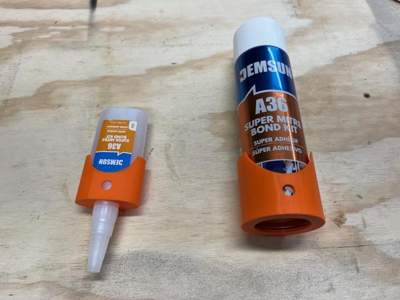 spray can holder and two different crazy glue holders that can wall mount