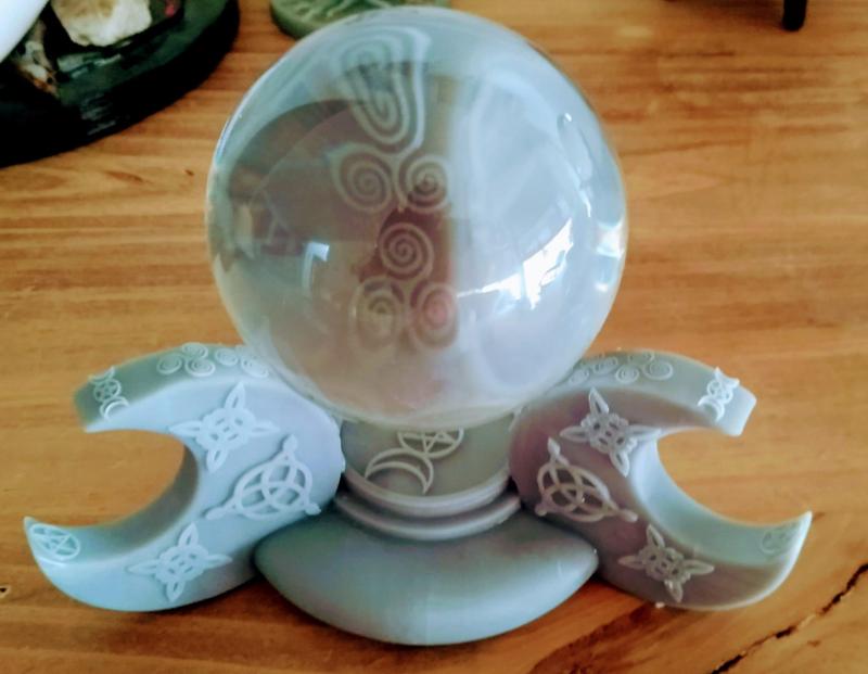 Crystal ball holder and wicca candle