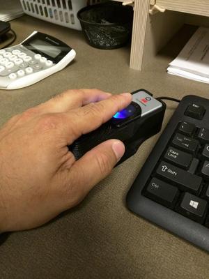 Ergonomic biometric holder