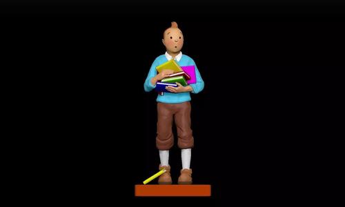 Tintin statue of boy holding book