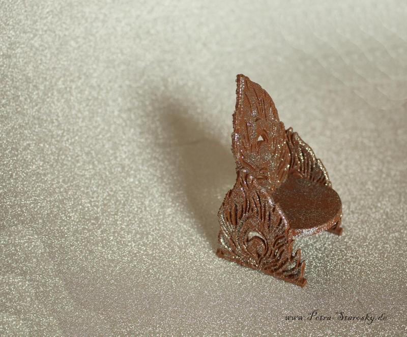 Armchair in peacock feather design