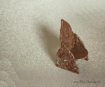 Armchair in peacock feather design