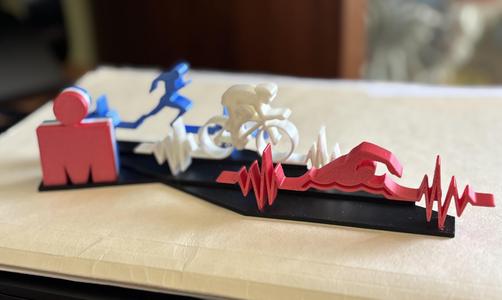 Display stand for swim, bike, and run and triathlon logo