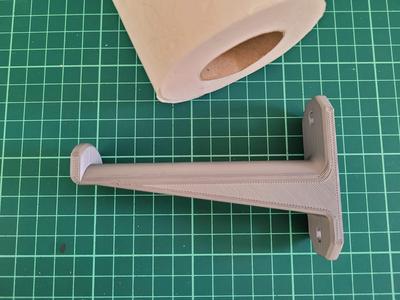 Toilet paper roll holder wall