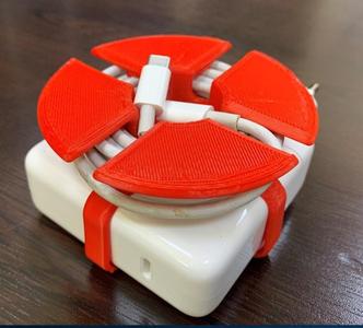 Mac book adapter cable holder