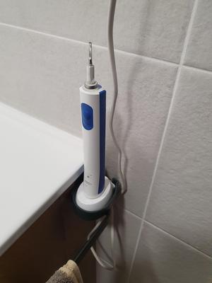 Tootbrush support over towel bar