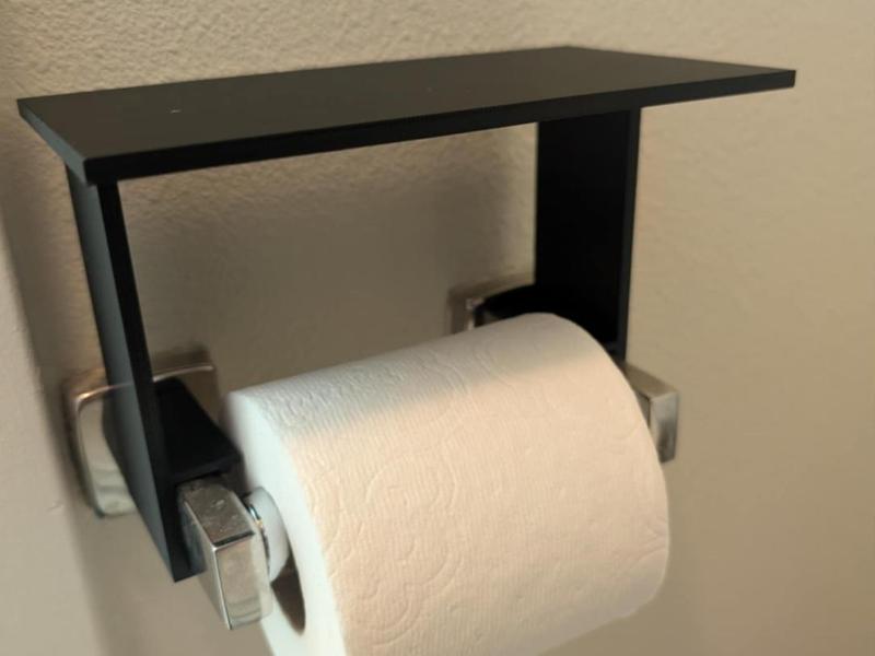 Phone Shelf attachment to toilet paper roll holder