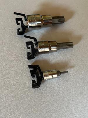 Quick release socket holders and rail to organize sockets in tool bag