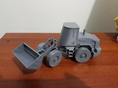Loader toy bulldozer on table