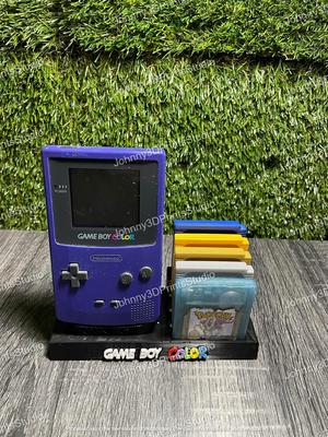GAMEBOY COLOR HOLDER / HAND WITH 5  GAME CARTRIDGES CASES