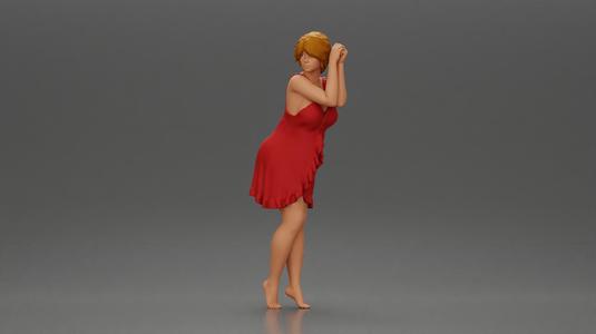 Barefoot woman in red nighty dress strikes a graceful elegant pose