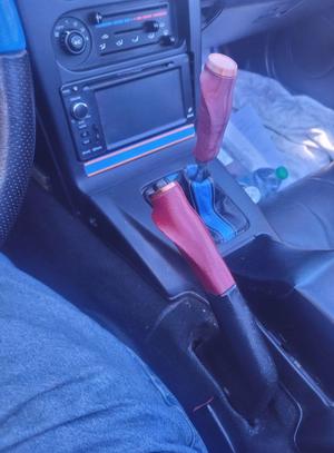 Pistol grip shifter and brake handle for Miata