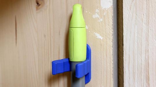 Universal hook for brooms and vacuum cleaners