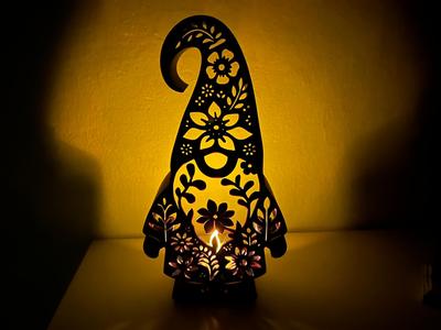 Dwarf with floral pattern as lamp 