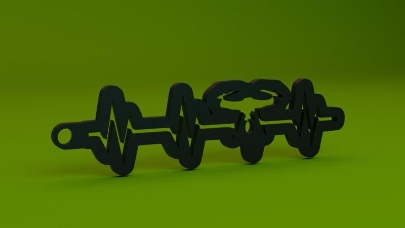 A keychain with a drone in the middle of the pulse