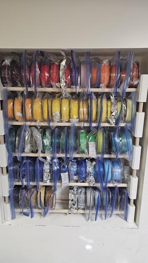 Filament rack with bottom brackets for 1" dowel.