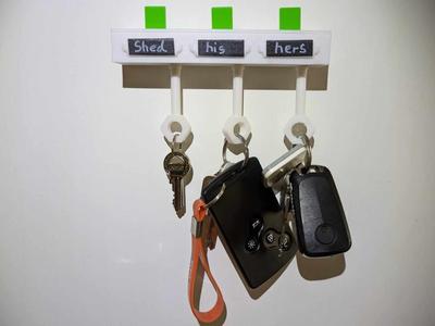 Key holder with pop up "who's in"