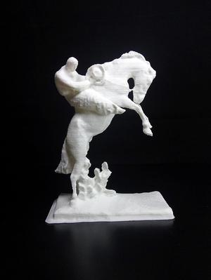 bucking bronco and a steadfast cowboy in wool chaps